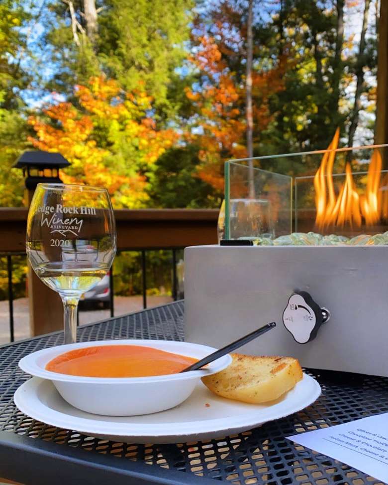outdoor table with food and wine glass