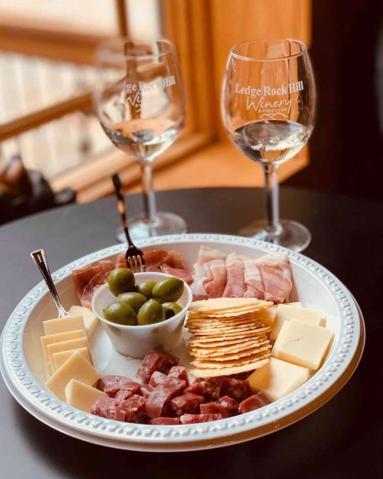 cheese and meat plate and wine glasses