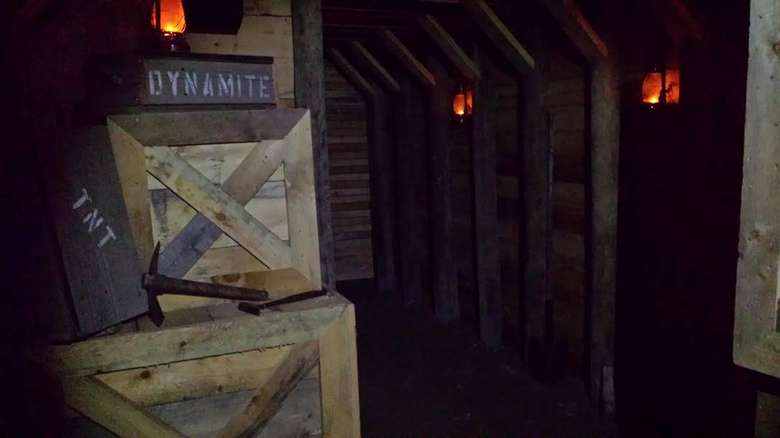 wooden hallway with crates