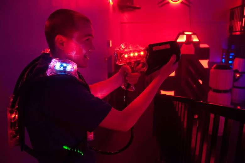 a boy playing laser tag
