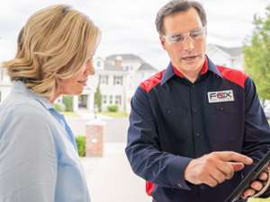 technician pointing at report