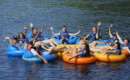 large group near each other on a lazy river trip