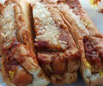 hot dogs covered mustard and ketchup