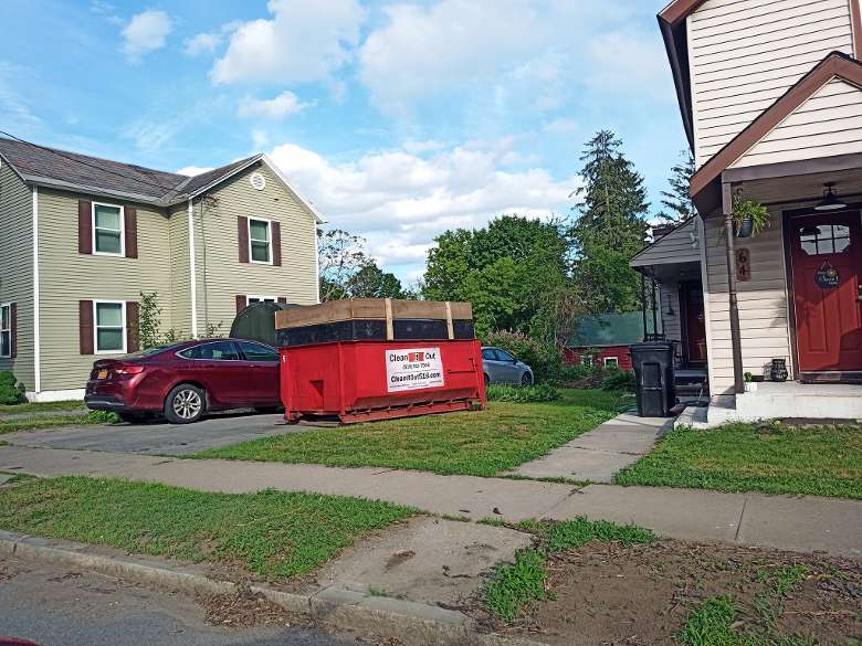 red dumpster outside of a house Glens Falls