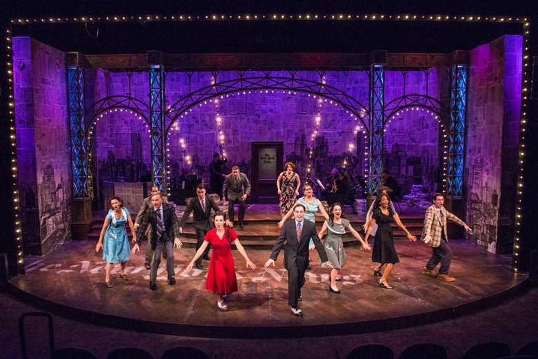 people perform on stage