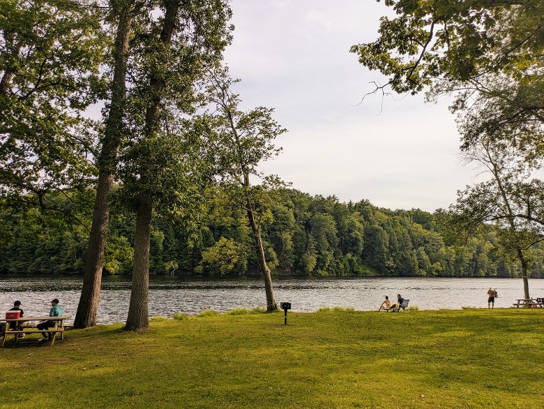 people picnic by water at haviland cove