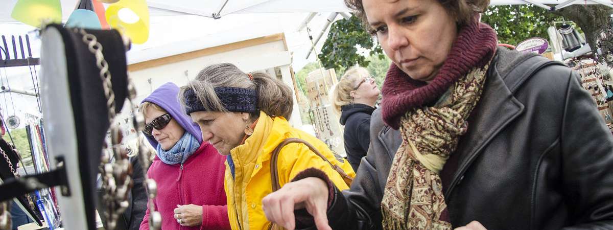 woman looking at box of jewelry