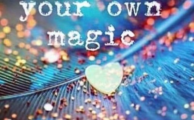 background of a blue feather, with glitter and the words "Believe in your own magic"