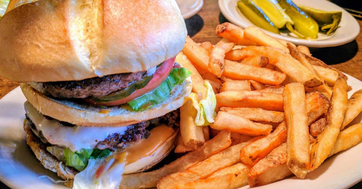 burger with fries and pickles