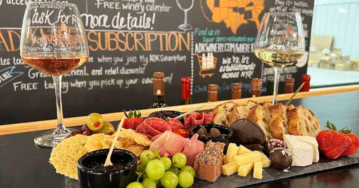charcuterie board with two wine glasses