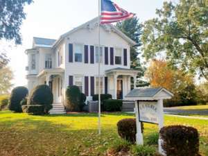 Exterior of a Funeral Home with American flag in front of it