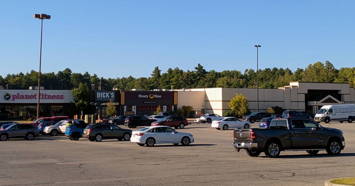 exterior of aviation mall with planet fitness, dick's, and ninety-nine restaurant
