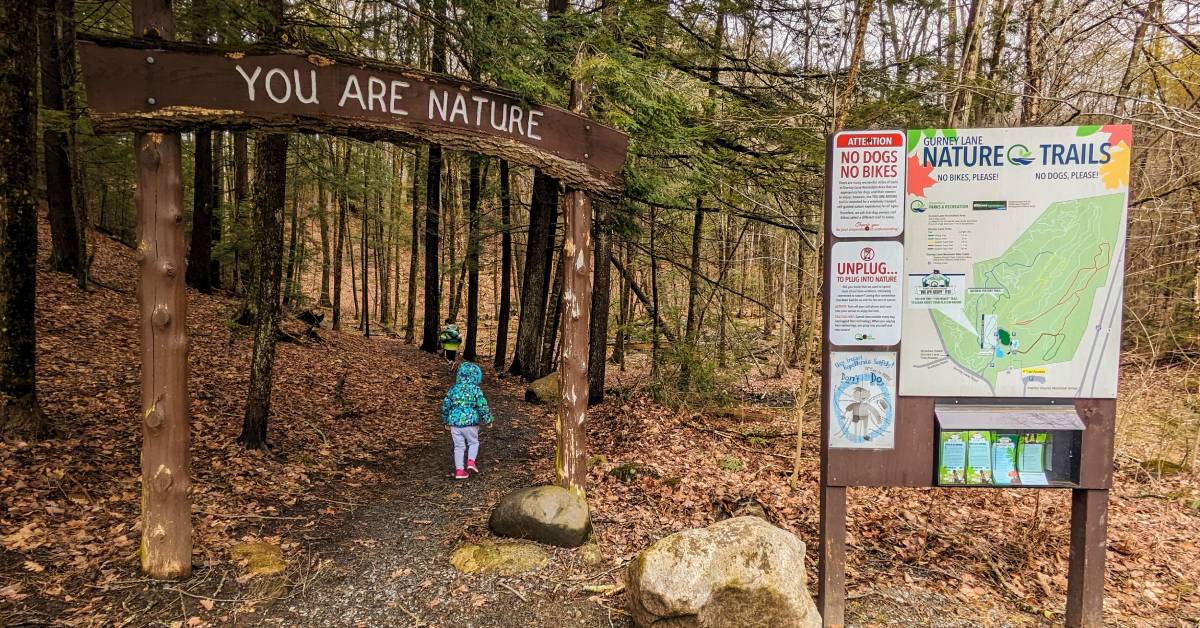 kid going into nature trail at gurney lane recreation area