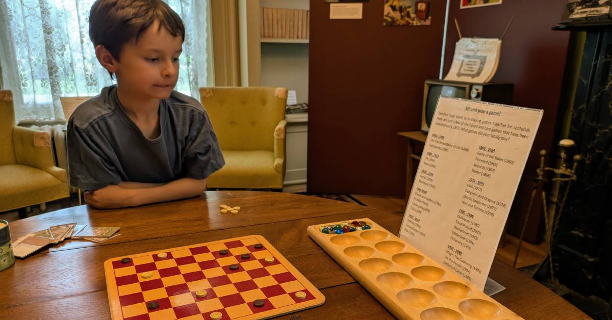 kid with games at chapman museum