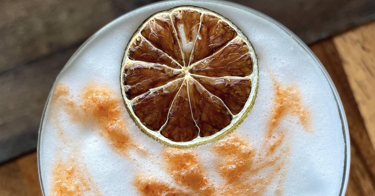 view looking down at cocktail with fruit garnish
