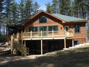 log house with deck