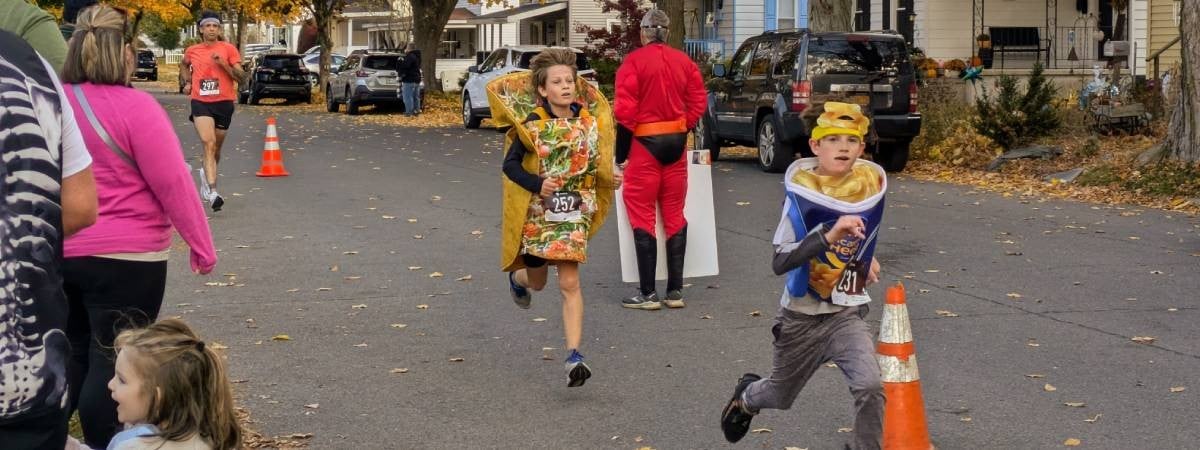 kids in taco and mac and cheese costumes running 5k