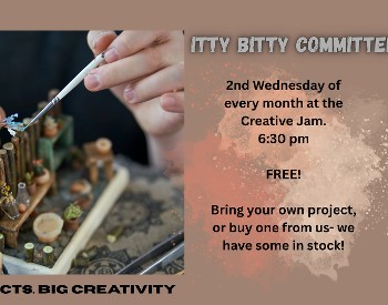 A pair of hands working to build a miniature scene