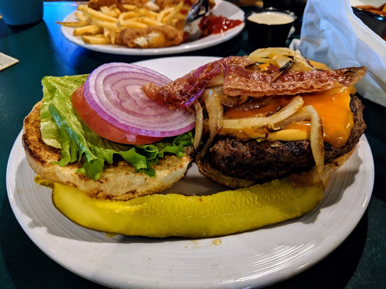 Their extensive menu offers a variety of pub favorites. burger with bacon
