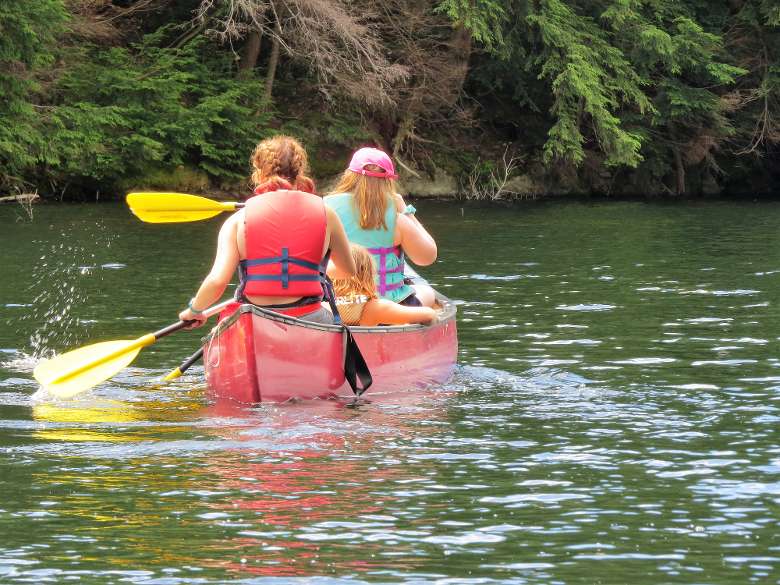 canoers paddling away
