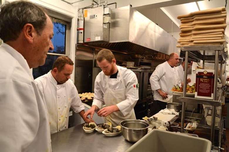 Chefs cooking in the kitchen.