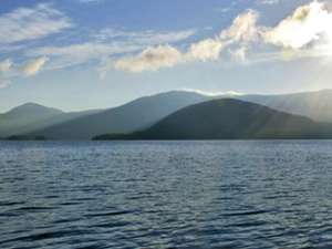 view of lake george with mountains in the background