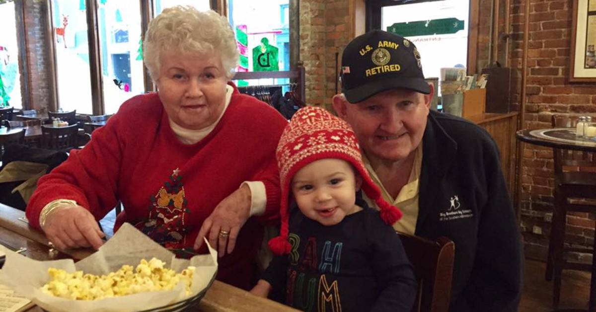 kid and grandparents at restaurant with popcorn