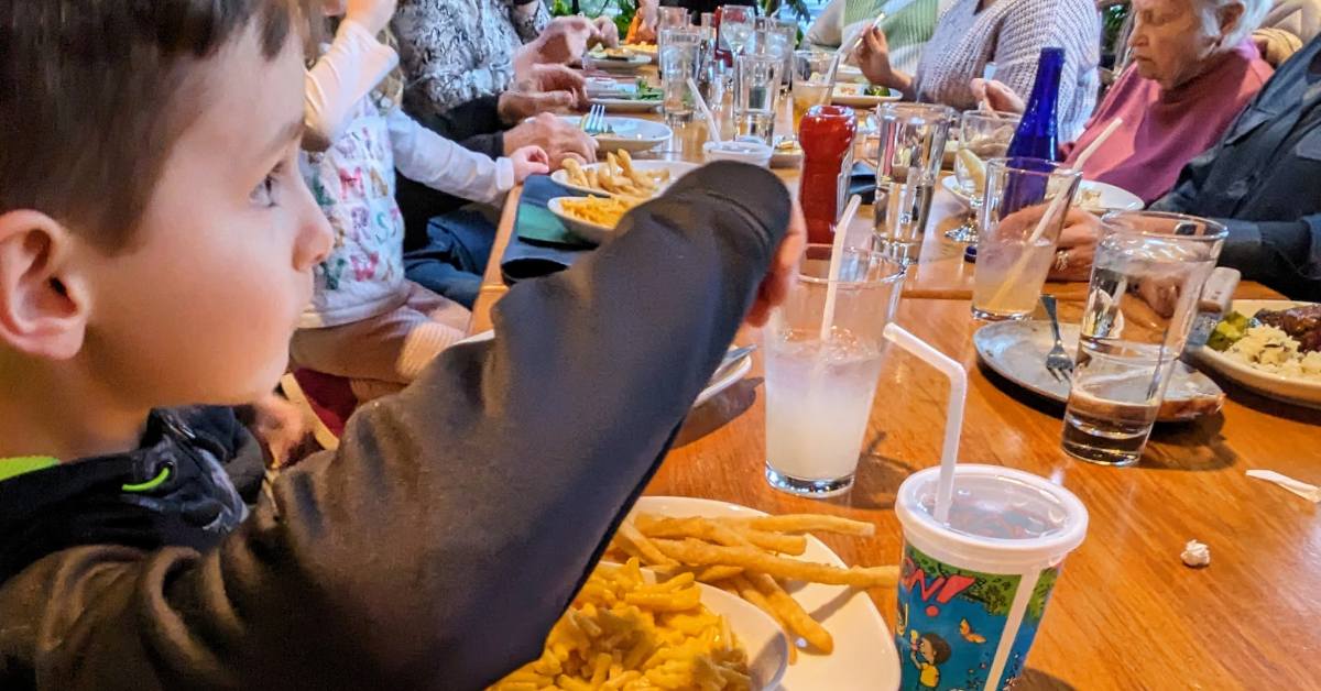 kid dining at the log jam restaurant in lake george