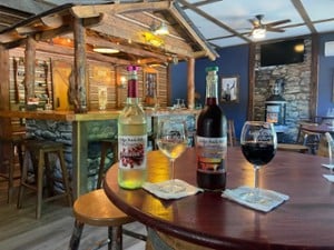 bottles and glasses of wine on a table