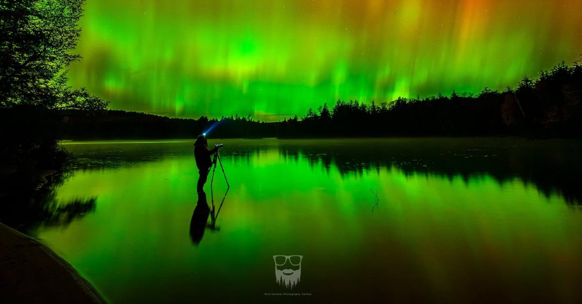 artsy photo of person looking at the northern lights