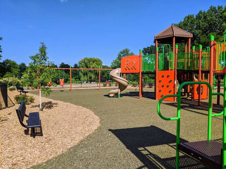 playground with slide, wings, bench