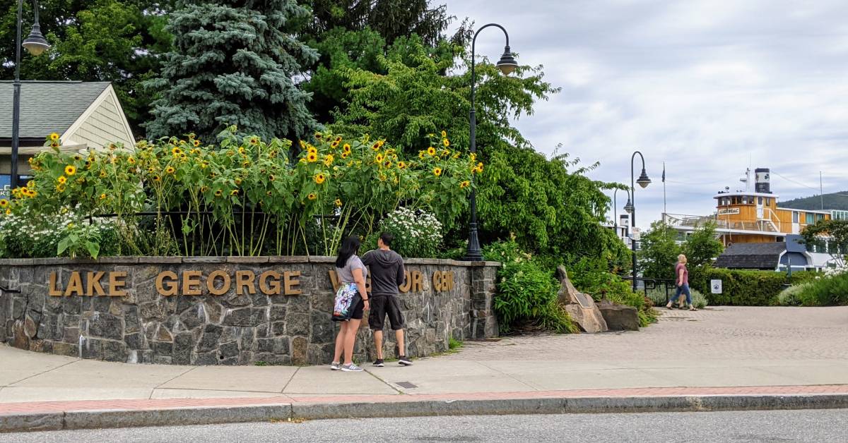 couple outside lake george visitors center