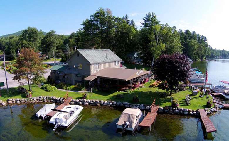 An aerial view of the restaurant showing the surrounding lake, docks and boats.