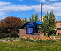 queensbury school district sign with tulips