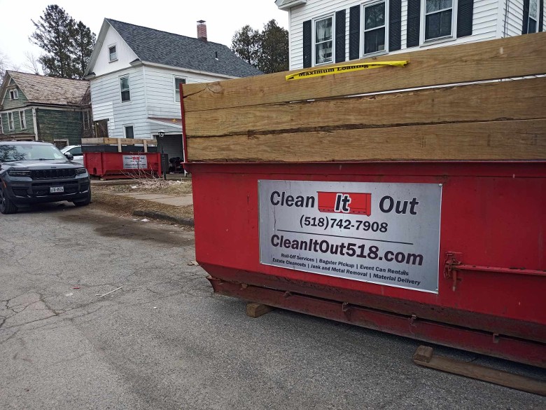 2 neighbors cleaning their junk out in Fort Edward