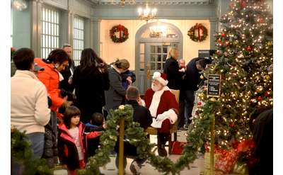 line up people waiting to meet santa