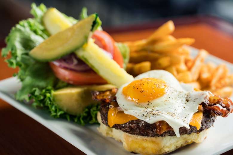 Sunnyside Burger with pickle and fries