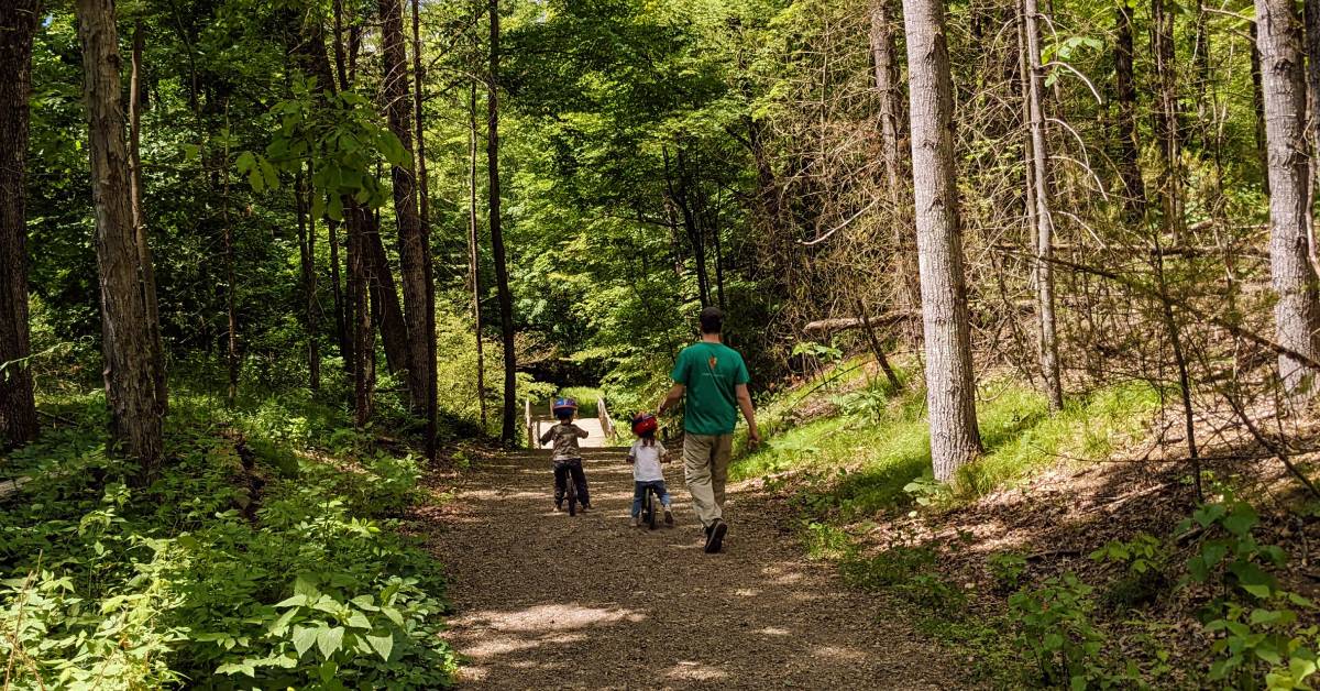 family walks on rush pond trail in queensbury