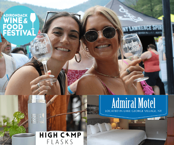 two friends holding wine glasses at the Adirondack Wine & Food Festival